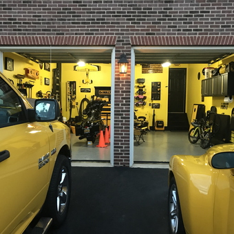Organized yellow garage with tool storage and bikes - Doug from Ashburn, VA