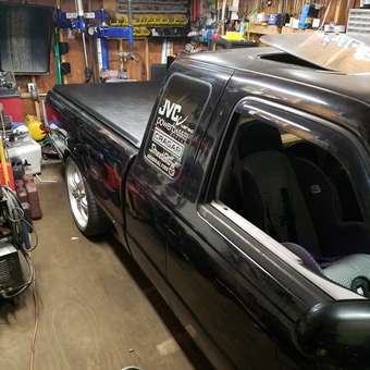 Custom truck in organized garage with tools and parts - Jason from Newark Valley, NY