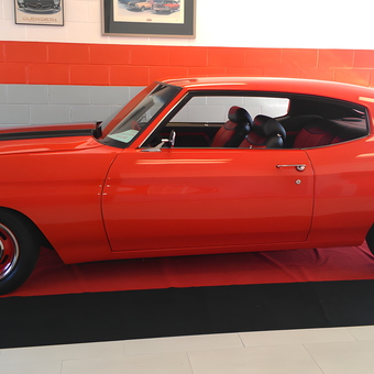 Classic Red Muscle Car Displayed on Red Mat - A.P. from Pasadena, CA