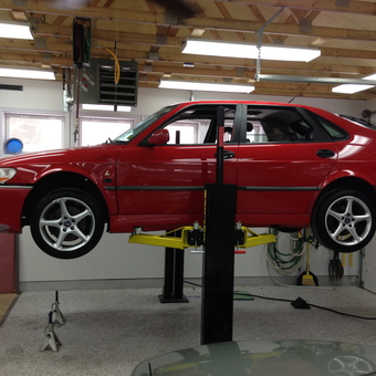 Red car on two post lift in organized garage - jxh from Saint Paul, MN