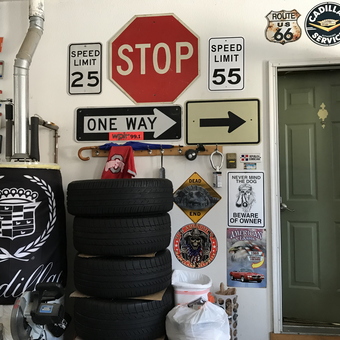 Garage Wall with Signs, License Plates, and Tires - Silver Fox from Sylvania, OH