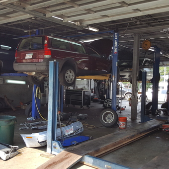 Auto Repair Shop With Rotary Lifts and Tools - Dinger from Littleton, MA