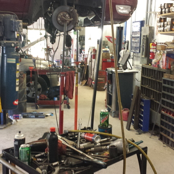 Organized mechanic garage with shelves, lift, and tool cart - Dinger from Littleton, MA