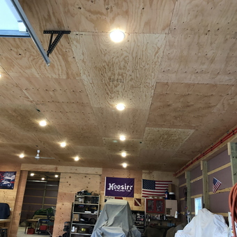 Well-Lit Garage With Plywood Ceiling and Wall Decor - Robert from Tuckerton, NJ
