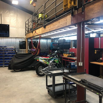 Organized garage with tool cabinets, workbenches, and motorcycles - Colin from Lakewood, CO