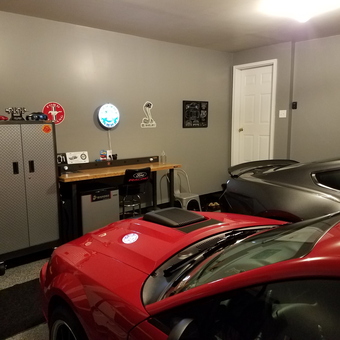 Organized garage with workbench, storage, and cars - Phil from Keene, NH