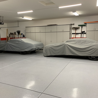 Organized garage with car covers, cabinets, and wall storage - Rett from Scottsdale, AZ