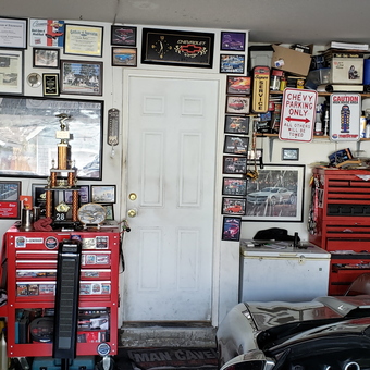 Organized garage with tool chests, car memorabilia, and trophies - Ulysses from Alta Loma, CA