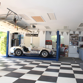 Organized garage with car lift, cabinets, and checkered flooring - Darren from Camarillo, CA