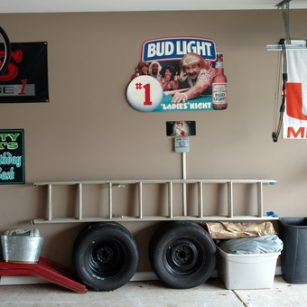 Organized Garage with Ladder, Tires, and Wall Decor - Scotty Mack from Columbus, GA