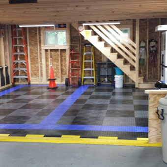 Organized garage with tile flooring and ladders - Bud from Waterville, ME