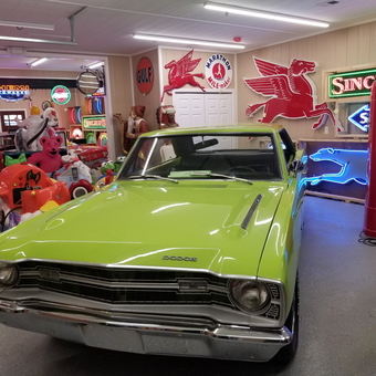 Classic Garage with Neon Signs and Gas Pump - Big Cheese