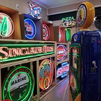 Vintage Neon Gas Station Signs and Pumps Display - Big Cheese