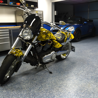 Custom motorcycle and blue Mini Cooper in organized garage - John from Piedmont, SC