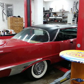 Classic red car in organized garage workspace - Arne from Ostersund Sweden