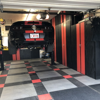 Custom garage with car lift, cabinets, and flooring - RazorSVT from Fort McMurray