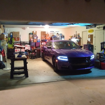 Organized garage with purple car, storage, and tools - Old Skool from La Quinta, CA