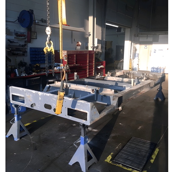 Vehicle Frame on Jack Stands in Workshop - Spike from Maple Grove, MN