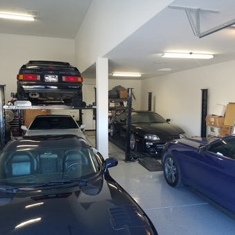 Home garage with car lifts, sports cars, and storage - Guilly from PHOENIX, AZ