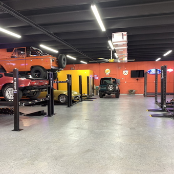 Spacious garage with car lifts and neon signs - Reuben from Golden Beach, FL