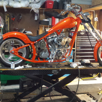 Custom Orange Motorcycle on Lift in Organized Garage - James from Winter Springs, FL