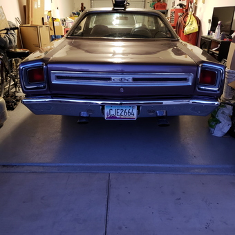 Classic car in organized garage with hose reel - Chris from GOODYEAR, AZ
