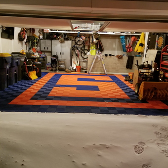 Organized garage with custom orange and blue floor tiles - Mike from Marcellus, NY