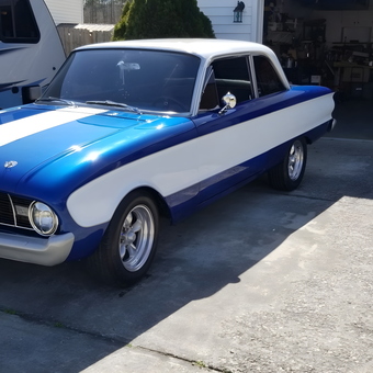 Classic blue and white muscle car outside organized garage - Rockys from PIKEVILLE, NC