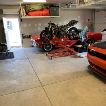 Organized garage with car lift, tool chest, and muscle cars - Jon from Redding, CA