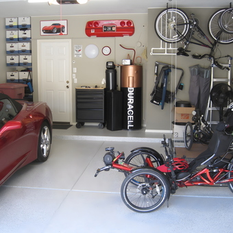Organized garage with storage, bikes, and red car - JU from Scottsdale, AZ