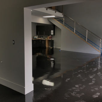 Modern garage with black epoxy floor and cabinets - Greg from Bartlett, IL