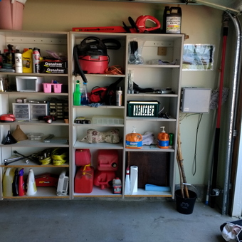 Organized garage shelves with tools, gas cans, and supplies - Tommy from Sun City, CA