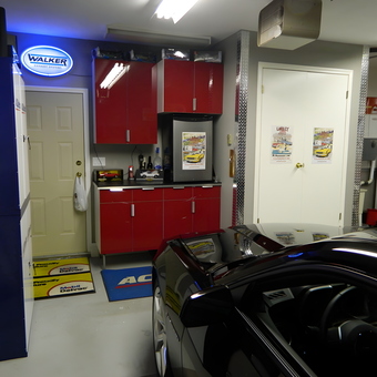 Modern garage with red cabinets and neon sign - Russ from Langley, BC Canada