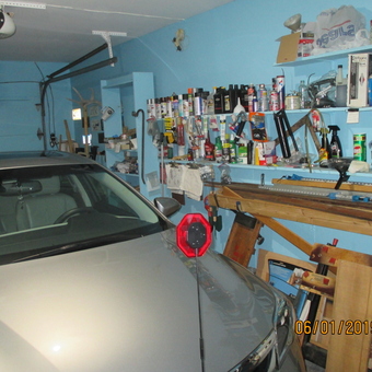 Organized garage with shelving, car, and tools - Duke of Oil from Tolland, CT