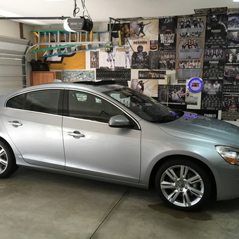 Organized garage with silver sedan and wall storage - Sam from Fort Wayne, IN