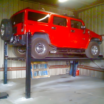 Red SUV on Four Post Car Lift in Garage - Eric from Staten Island, NY