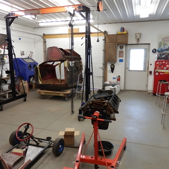 Organized garage with engine hoist, workbenches, and go-kart - Richard from Sterling, NY