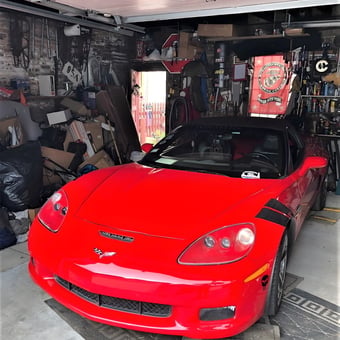 Red Corvette in Organized Garage with Tools and Signs - Marv from Chicago, IL