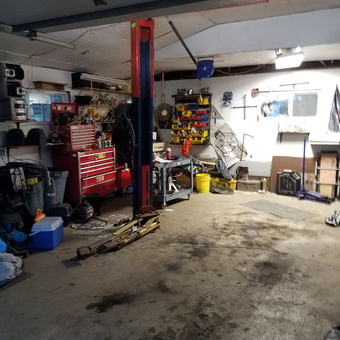 Organized garage with car lift and tool storage - Don from Hollandale, MN