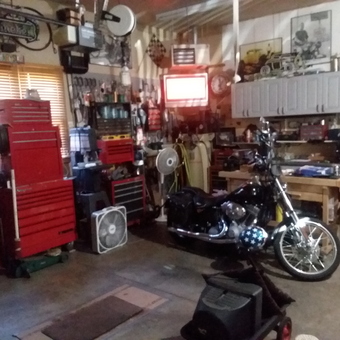 Organized garage with tool chests, workbench, and motorcycle - bohlen from Bartonville, IL