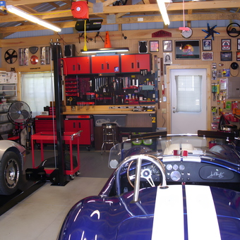 Organized garage with tool cabinets, car lift, and classic cars - Randy from Richmond, VA