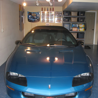 Organized garage with blue Chevrolet and storage bins - Stanley from Blairsville, PA
