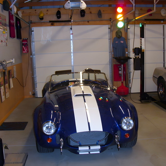 Classic car garage with lift, wall decor, and traffic light - Randy from Richmond, VA