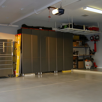 Organized garage with cabinets, tool chest, and storage racks - Tony from Arizona
