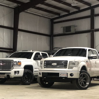 White GMC and Ford Trucks in Spacious Steel Garage - Gabes from Braintree, MA