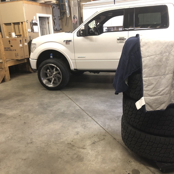 Garage with White Truck, Spare Tires, and Parts Boxes - Gabes from Braintree, MA