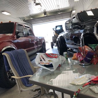 Spacious Garage With Trucks, Table, and Chair - Ronald from Stanley, ND