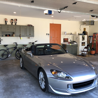 Organized Garage with Cabinets, Bikes, and Silver Convertible - Muzzy from Romeoville, IL