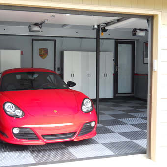 Modern garage with red sports car and cabinets - Jim from Commack, NY