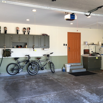Organized garage with cabinets, bikes, and hose rack - Muzzy from Romeoville, IL